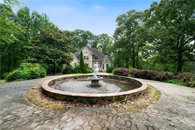 a swimming pool with view of trees