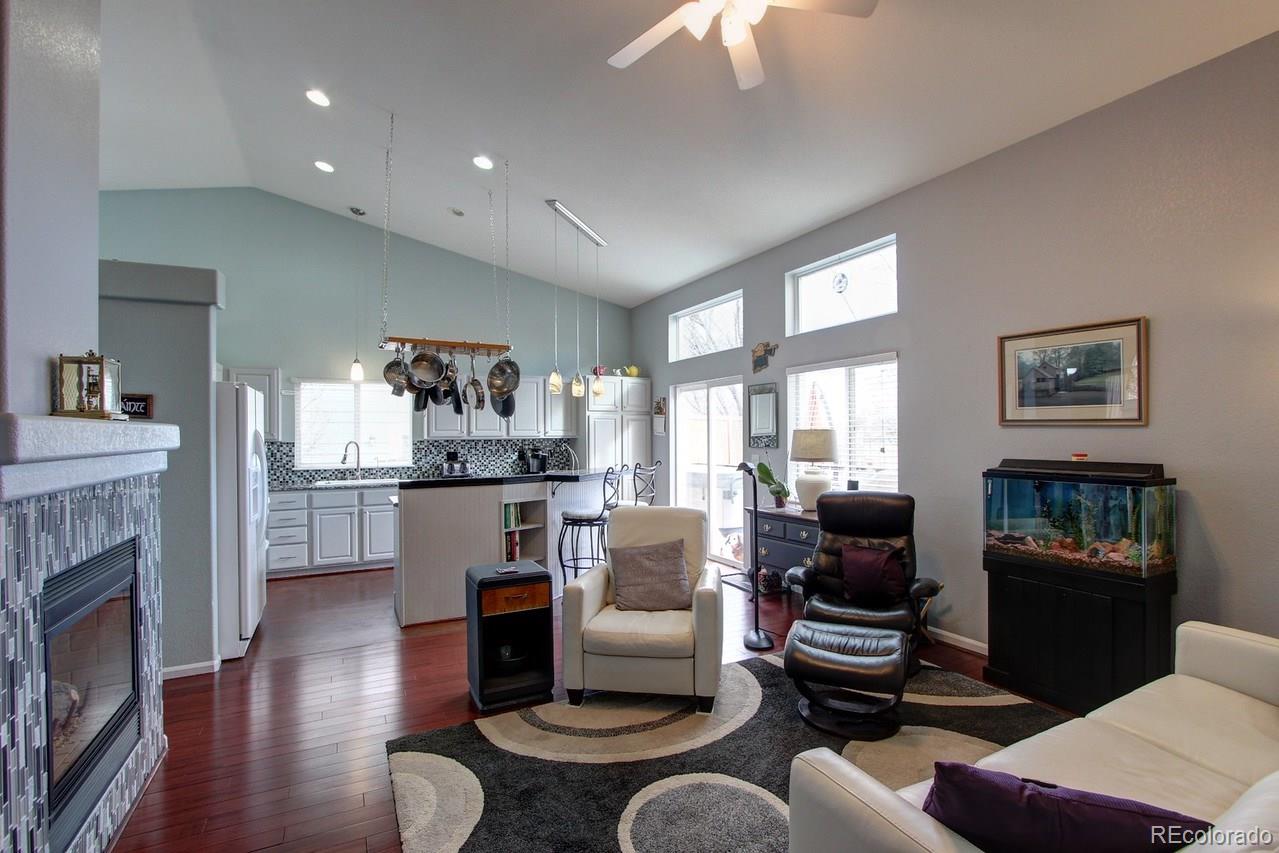 805 Nelson Park Drive Longmont, CO 80503 - Photo 13 of 33 a living room with furniture and a fireplace
