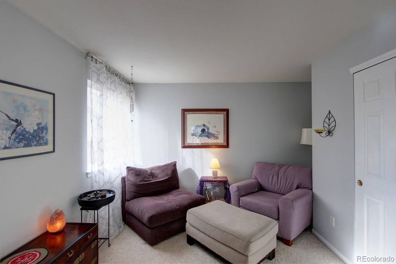 805 Nelson Park Drive Longmont, CO 80503 - Photo 19 of 33 a living room with furniture a couch and a window