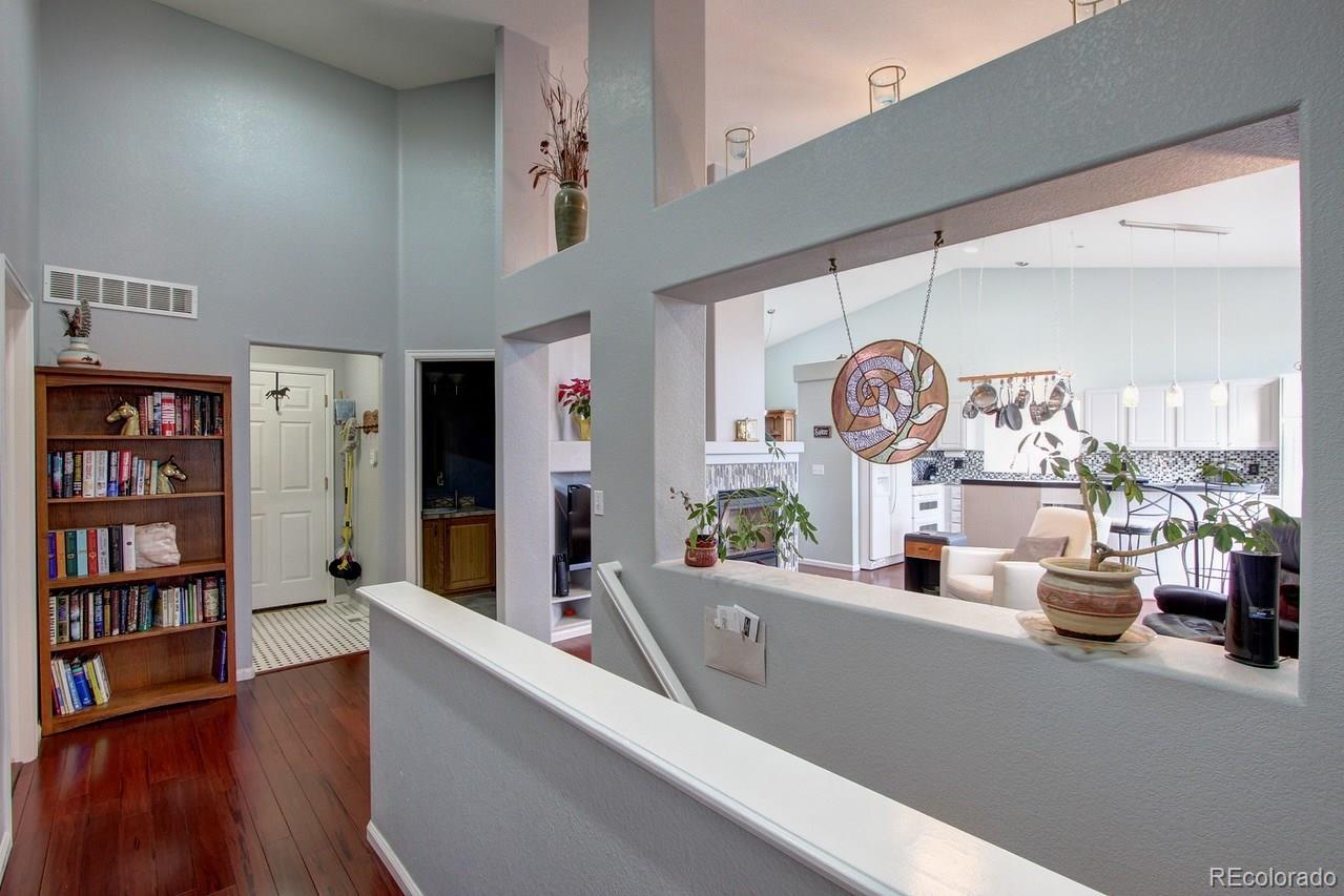805 Nelson Park Drive Longmont, CO 80503 - Photo 22 of 33 a living room with furniture and a large window