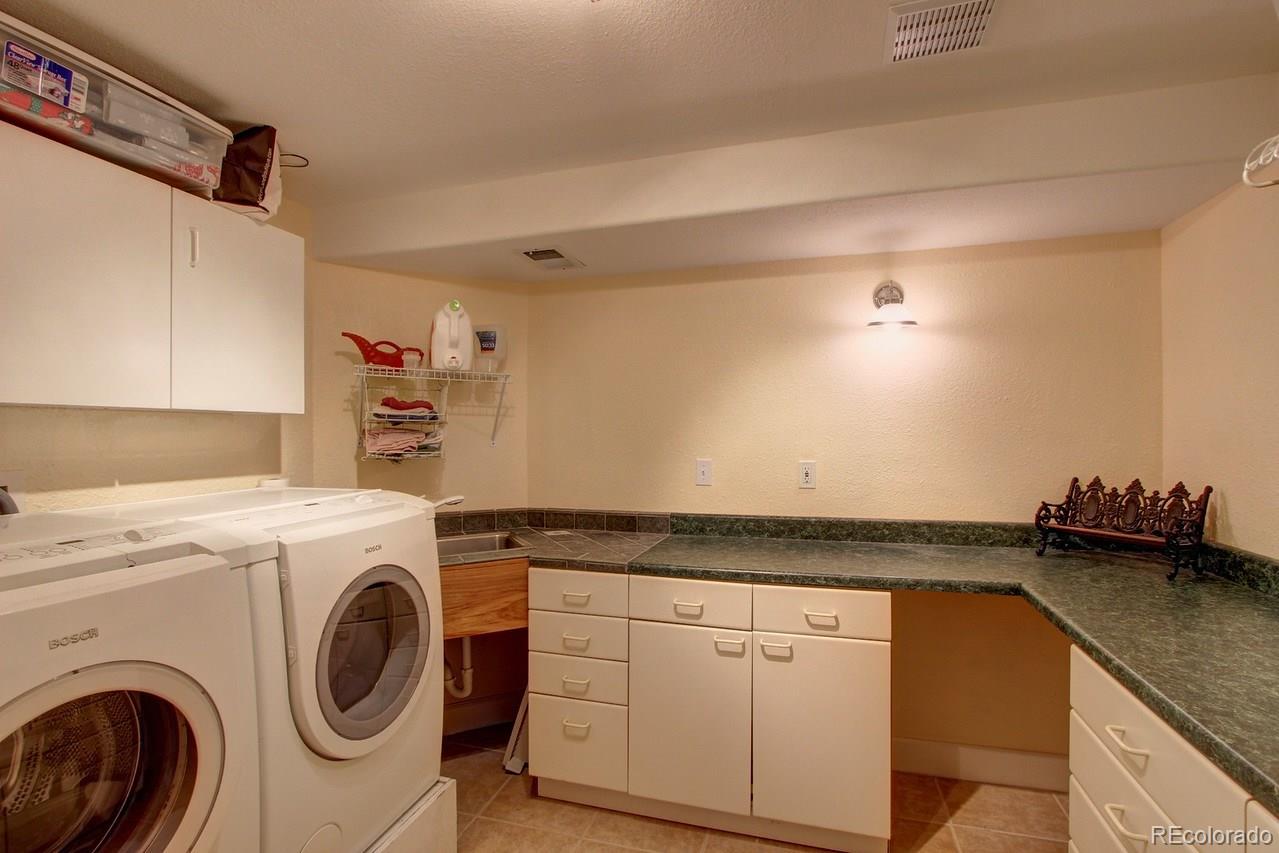 805 Nelson Park Drive Longmont, CO 80503 - Photo 25 of 33 a utility room with dryer and washer