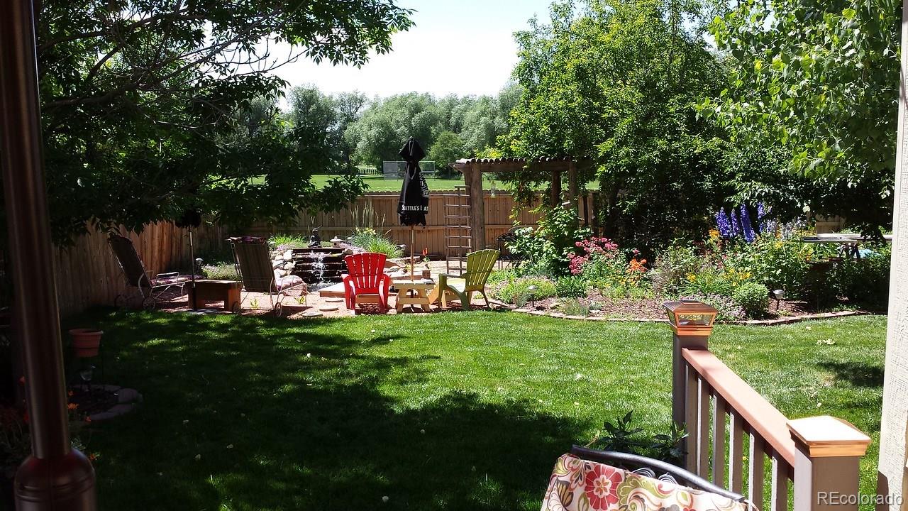 805 Nelson Park Drive Longmont, CO 80503 - Photo 29 of 33 a childrens park with lots of swings and slides