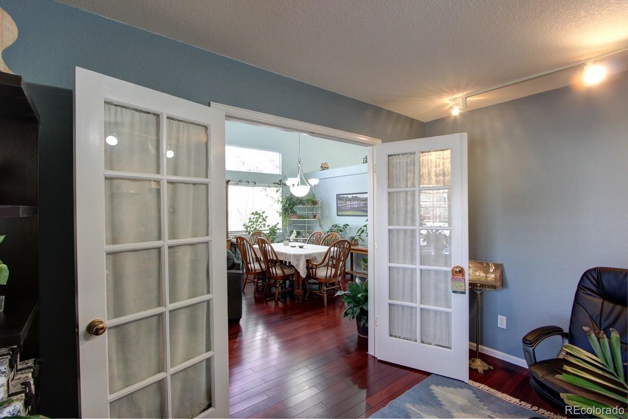 805 Nelson Park Drive Longmont, CO 80503 - Photo 6 of 33 a view of a livingroom with furniture and hardwood floor
