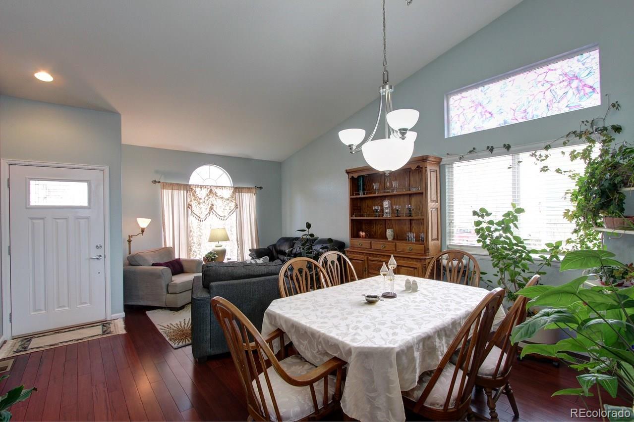 805 Nelson Park Drive Longmont, CO 80503 - Photo 7 of 33 a view of a dining room with furniture window and wooden floor