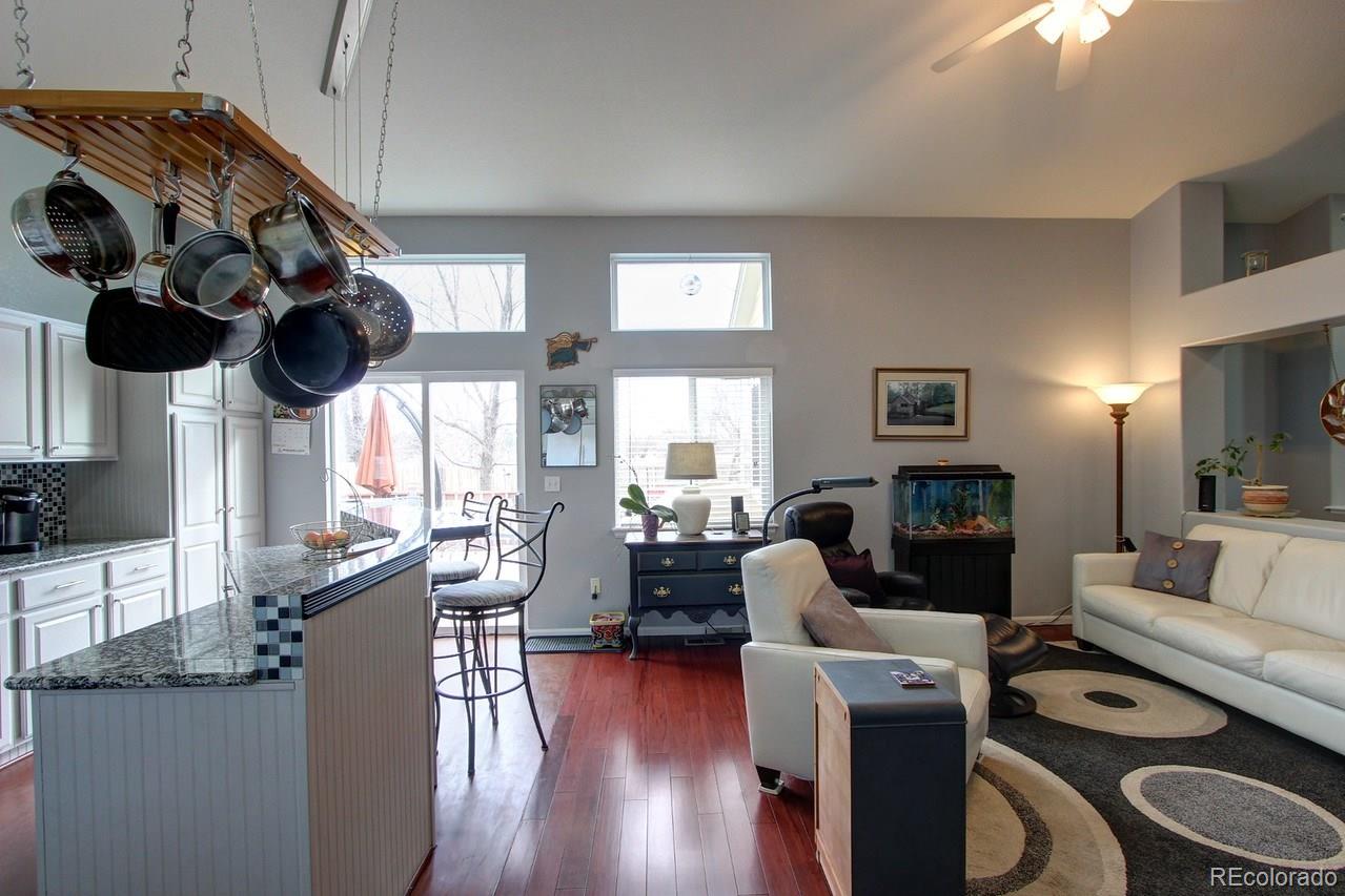 805 Nelson Park Drive Longmont, CO 80503 - Photo 9 of 33 a living room with furniture and wooden floor