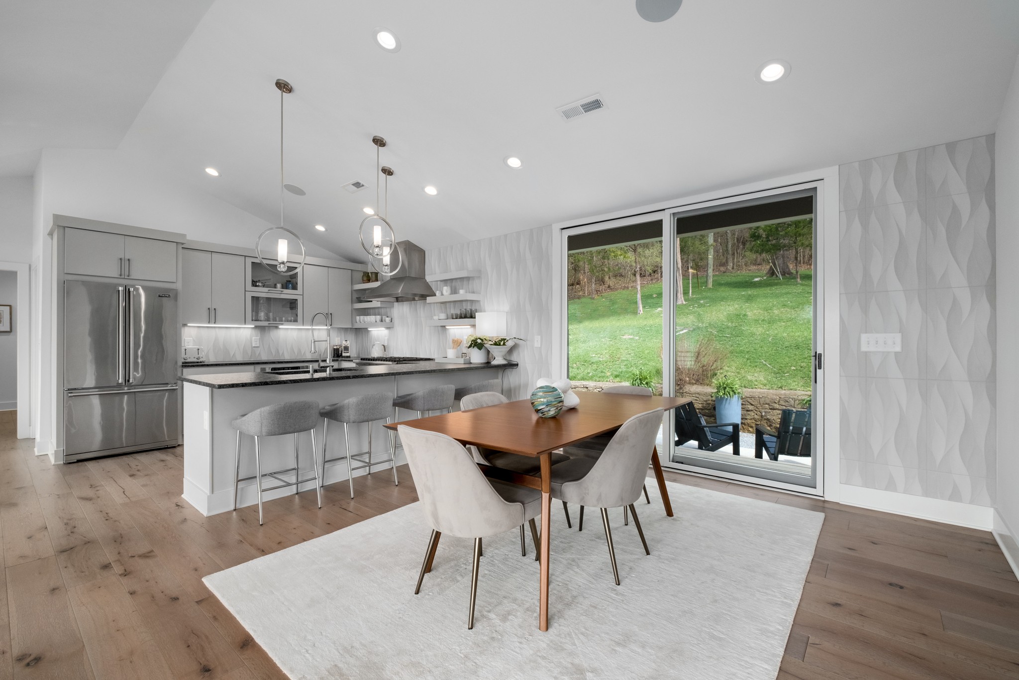 4628 Shys Hill Road Nashville, TN 37215 - Photo 15 of 42 a kitchen with kitchen island a large counter top space a sink stainless steel appliances and cabinets