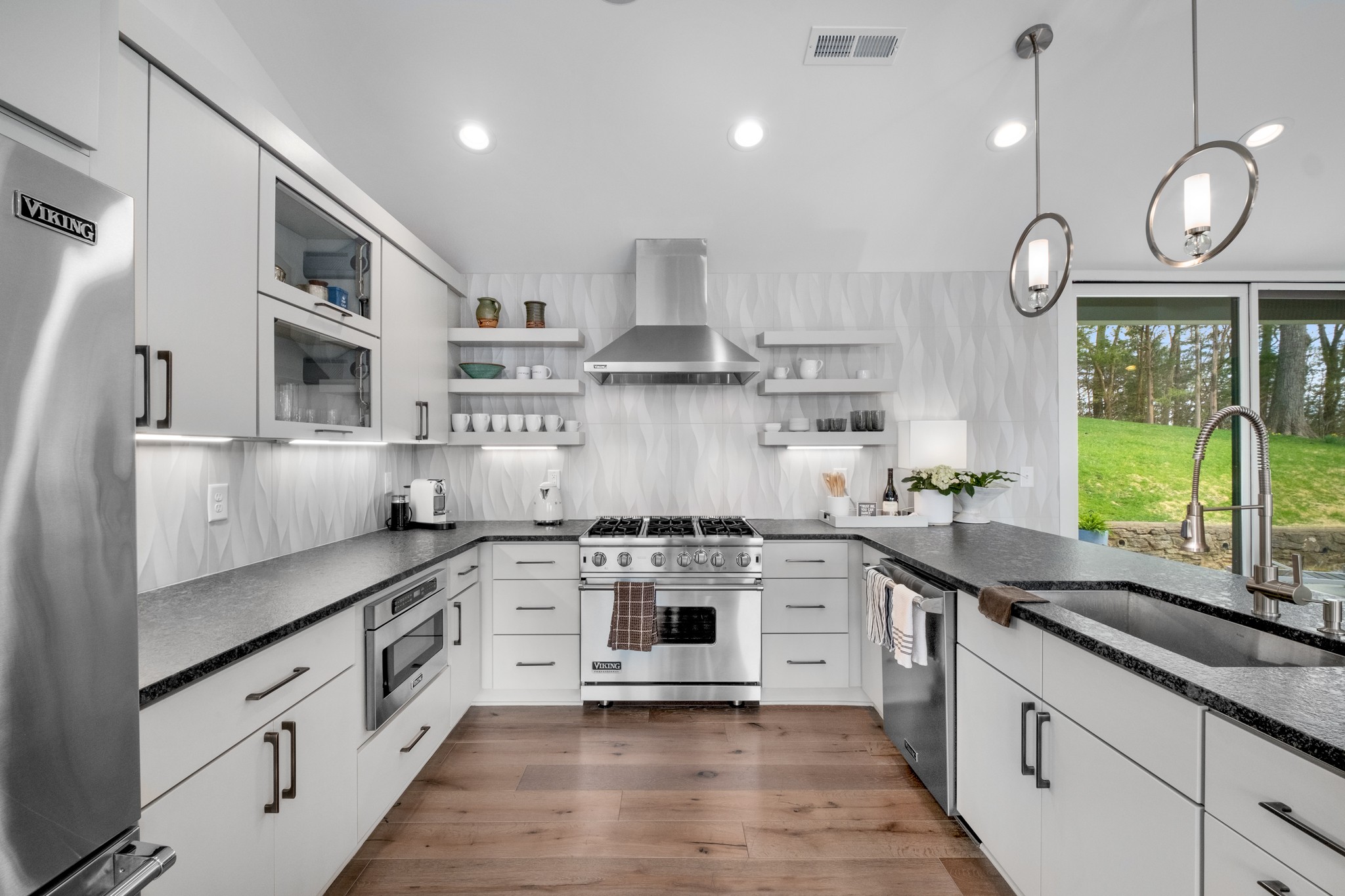 4628 Shys Hill Road Nashville, TN 37215 - Photo 17 of 42 a kitchen with stainless steel appliances granite countertop a stove a sink and a refrigerator