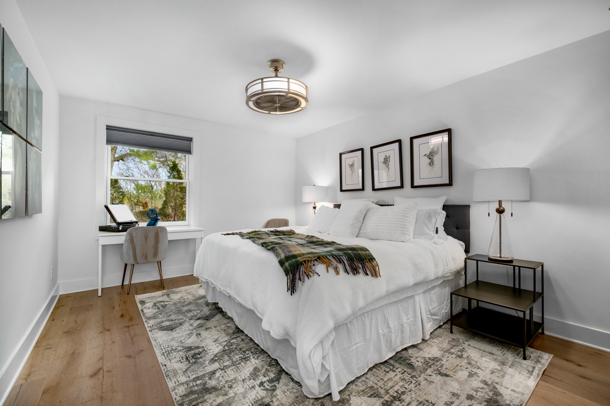 4628 Shys Hill Road Nashville, TN 37215 - Photo 25 of 42 a bedroom with a bed and a chandelier