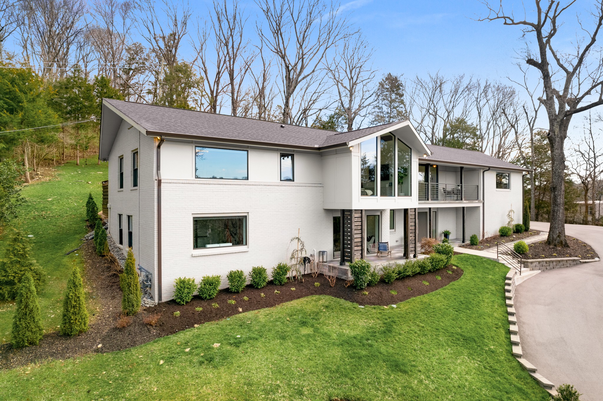 4628 Shys Hill Road Nashville, TN 37215 - Photo 4 of 42 a front view of a house with a yard and porch