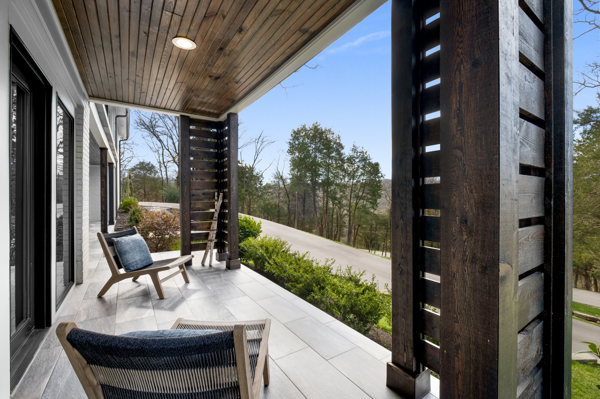 4628 Shys Hill Road Nashville, TN 37215 - Photo 5 of 42 a balcony with furniture and a garden