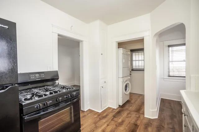 a kitchen with stainless steel appliances granite countertop a stove and a refrigerator