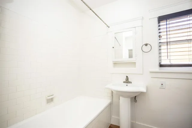 a bathroom with a sink a toilet and a bathtub