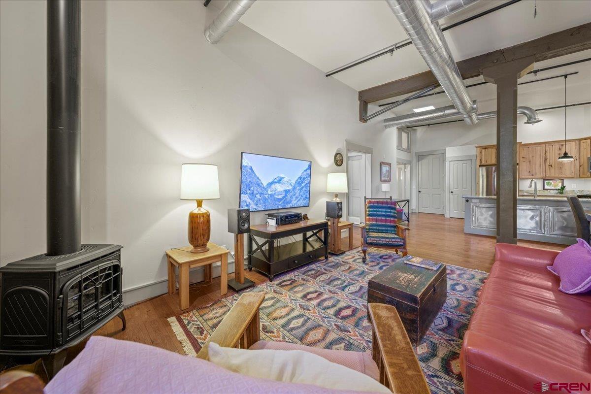 708 Main Street, Unit 3 Ouray, CO 81427 - Photo 12 of 28 a living room with furniture and a flat screen tv