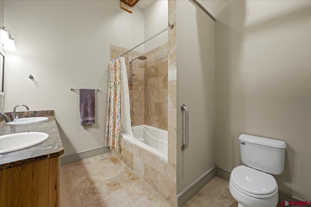 708 Main Street, Unit 3 Ouray, CO 81427 - Photo 17 of 28 a bathroom with a sink a toilet and shower