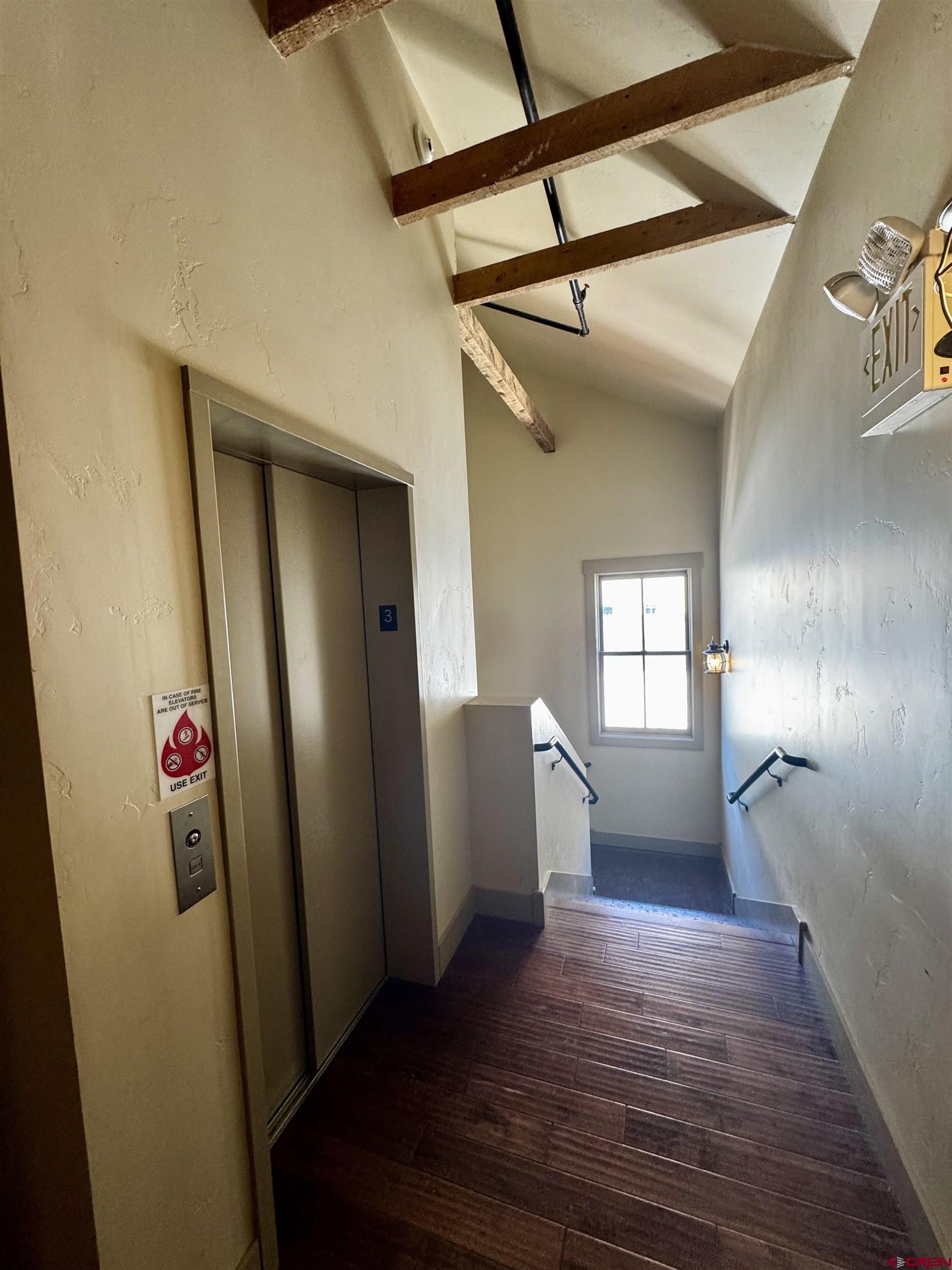 708 Main Street, Unit 3 Ouray, CO 81427 - Photo 20 of 28 a view of empty room with wooden floor and fan