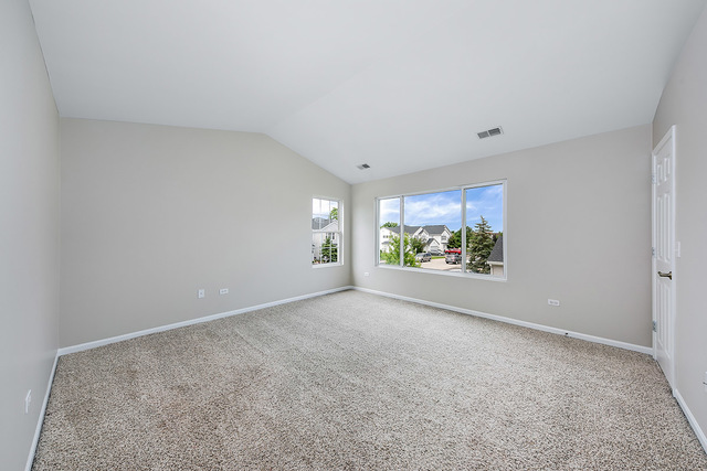 1079 Key Largo Drive Romeoville, IL 60446 - Photo 17 of 25 a view of an empty room with a window