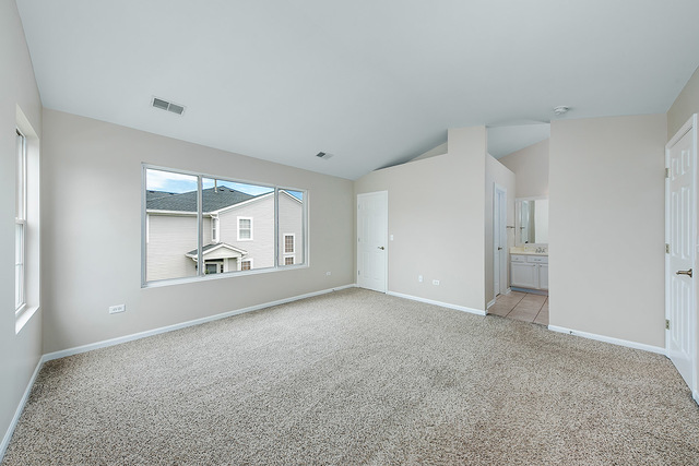 1079 Key Largo Drive Romeoville, IL 60446 - Photo 18 of 25 a view of an empty room with a window