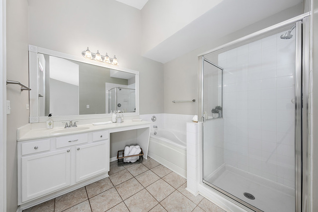 1079 Key Largo Drive Romeoville, IL 60446 - Photo 19 of 25 a spacious bathroom with a double vanity sink mirror and a shower