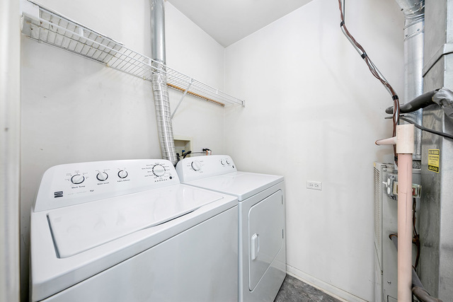 1079 Key Largo Drive Romeoville, IL 60446 - Photo 20 of 25 a utility room with dryer and washer