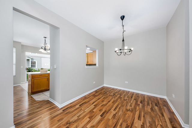 1079 Key Largo Drive Romeoville, IL 60446 - Photo 7 of 25 a view of empty room with wooden floor