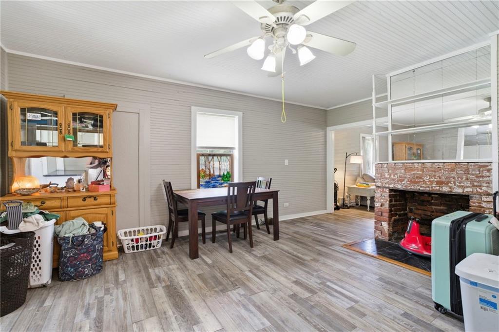 400 Sam Love Road Rocky Face, GA 30740 - Photo 15 of 29 a livingroom with fireplace dining area and a couch