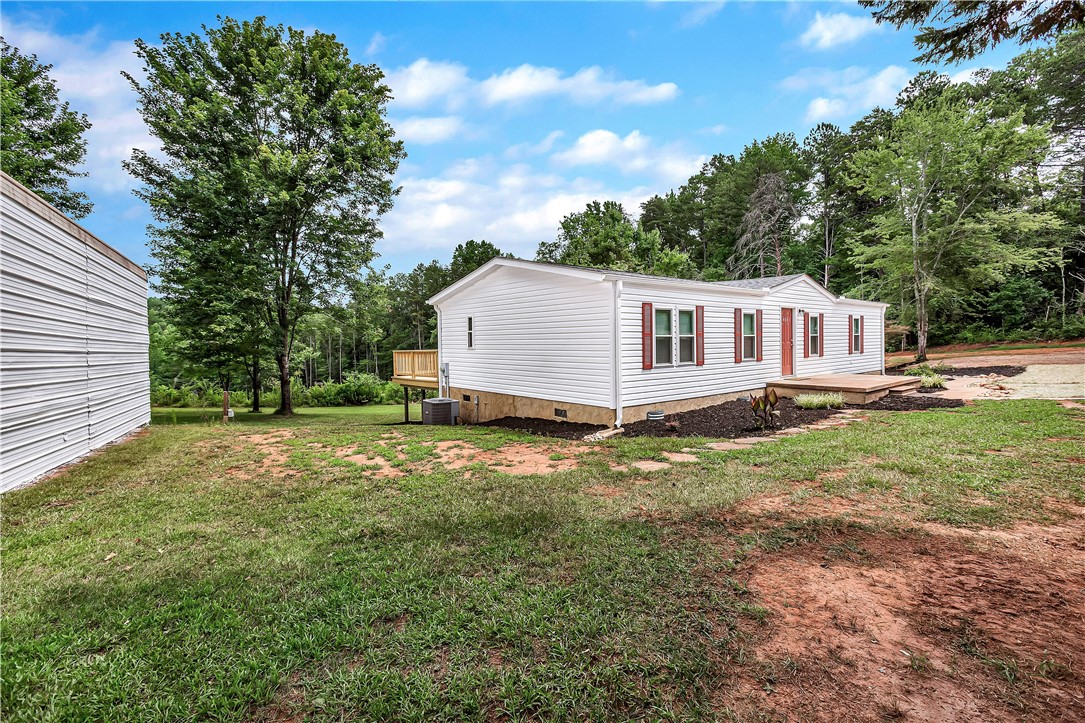 403 Hancox Place Westminster, SC 29693 - Photo 8 of 39 A quaint residence nestled among trees with a charming deck and front porch.