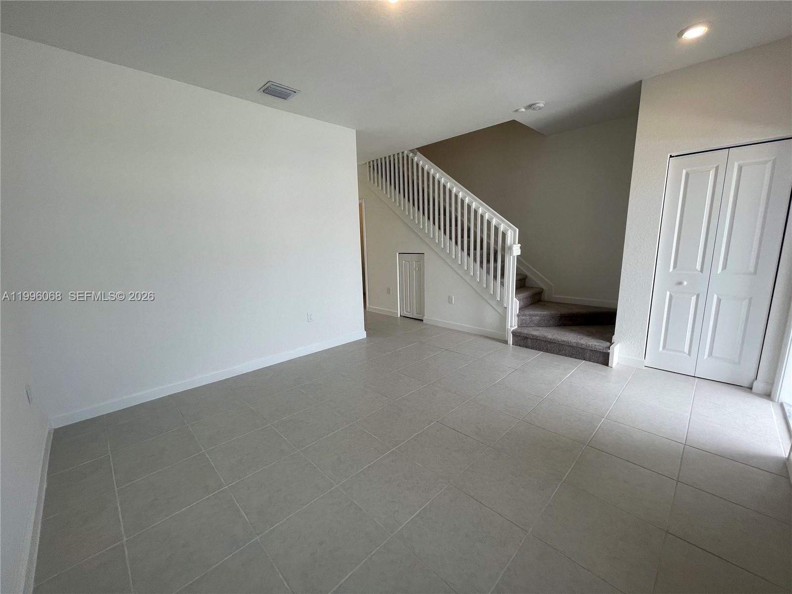 13262 Southwest 287th Terrace Homestead, FL 33033 - Photo 22 of 33 a view of a hallway with staircase