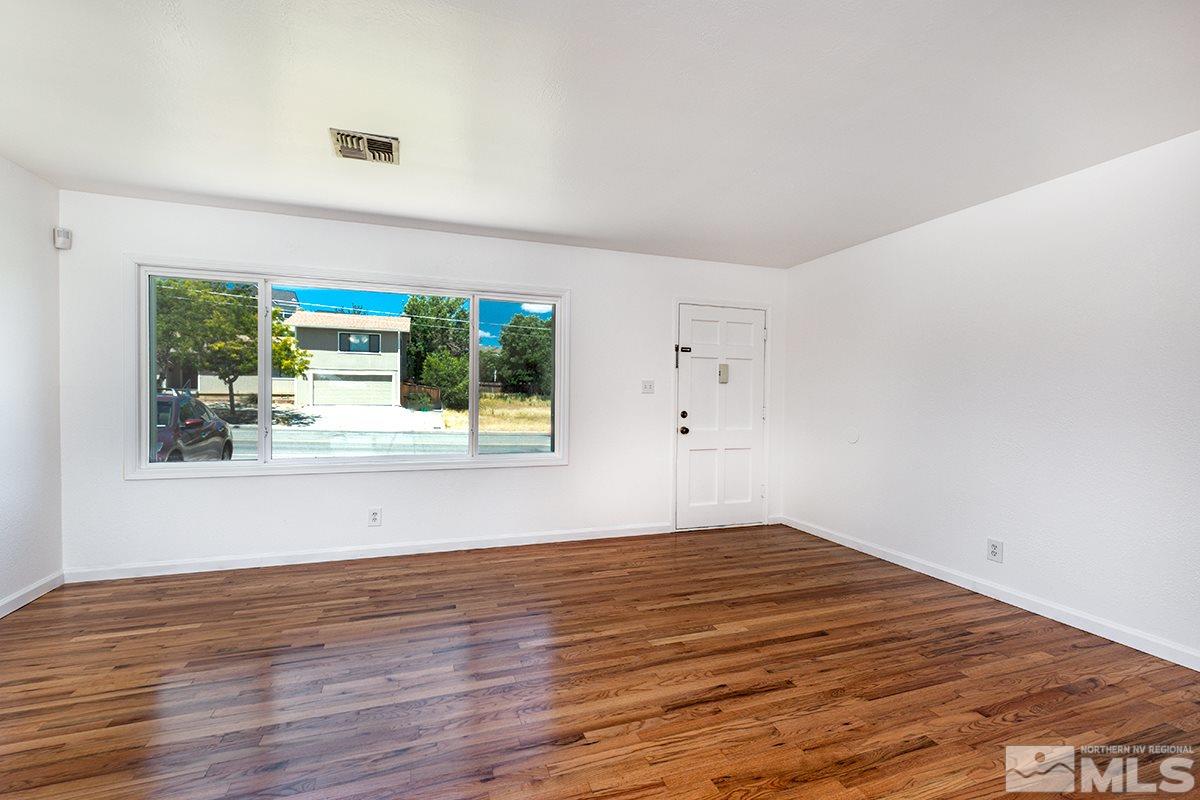 1525 Keystone Avenue Reno, NV 89503 - Photo 4 of 16 a view of a room with wooden floor and a window