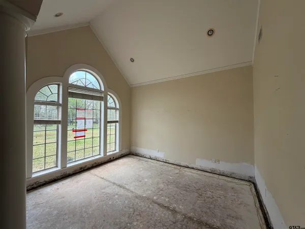 an empty room with windows