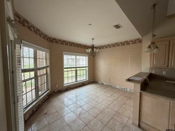 a view of an empty room and window