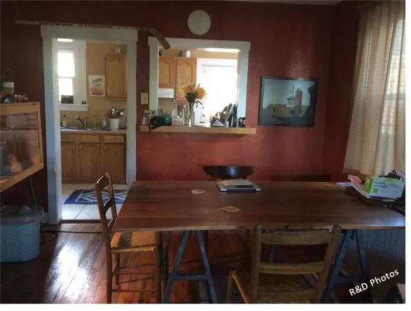 a view of a dining room with furniture and window