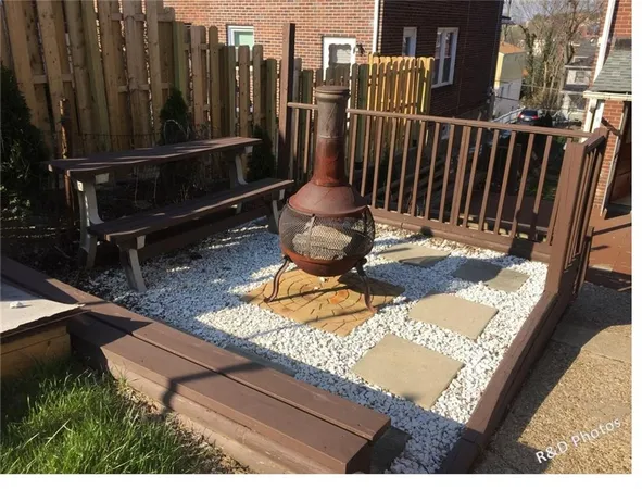 a view of a chairs and table in the patio