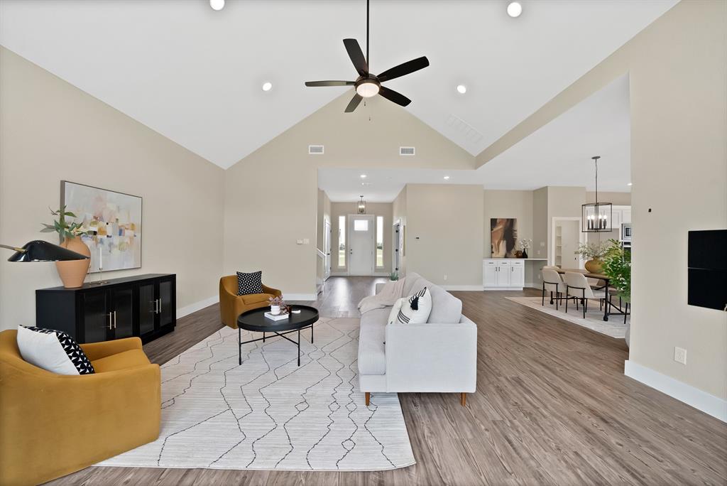 2223 Providence Way Nevada, TX 75173 - Photo 17 of 40 a living room with furniture and a wooden floor