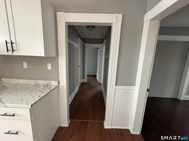 a view of a kitchen from the hallway