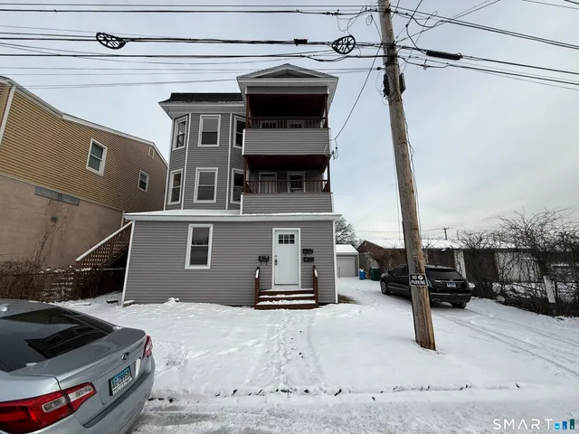 a view of a car park in front of house