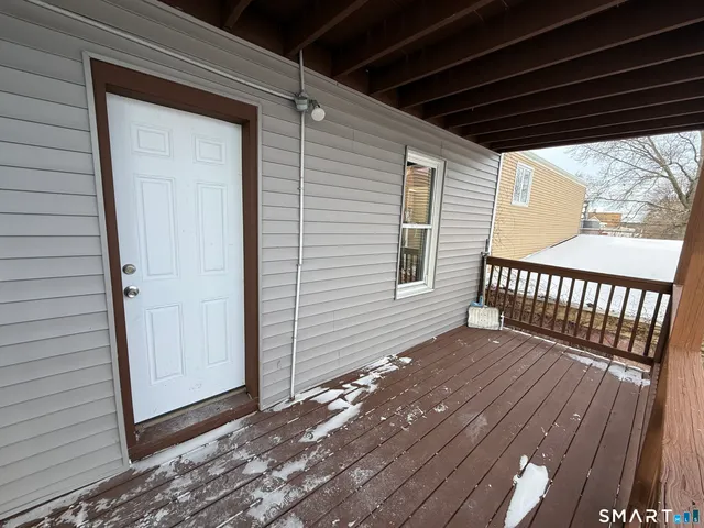 a view of a room with wooden floor