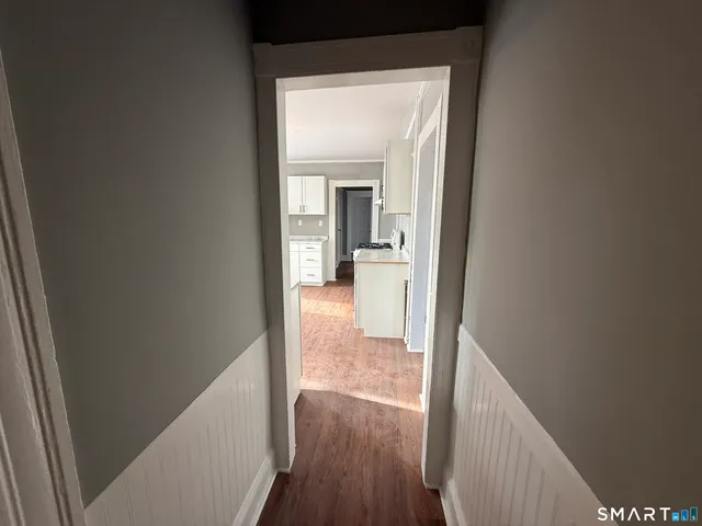 a view of a bathroom from a hallway