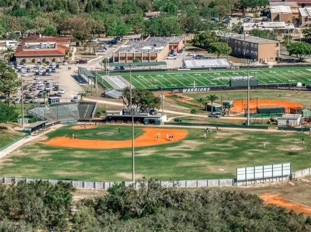 an aerial view of residential houses with outdoor space