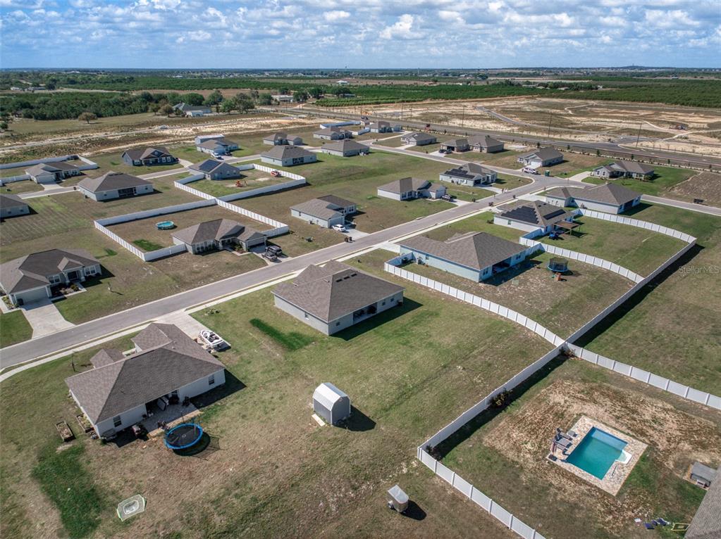 1113 Caloosa Ridge Way Babson Park, FL 33827 - Photo 18 of 77 an aerial view of residential houses with outdoor space