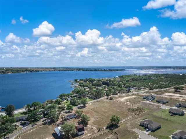 a kitchen with stainless steel appliances granite countertop a sink and a refrigerator