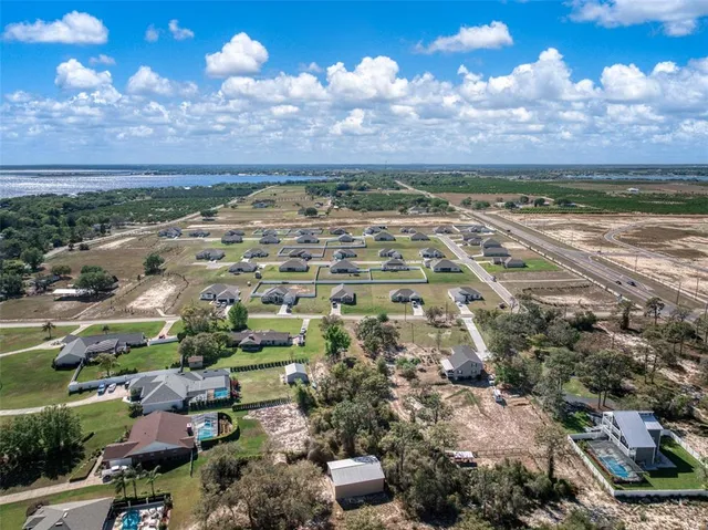 a kitchen with white cabinets and appliances