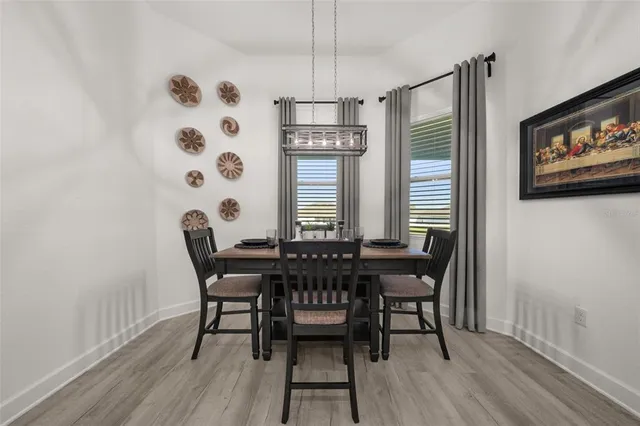 a living room with couches and a large window