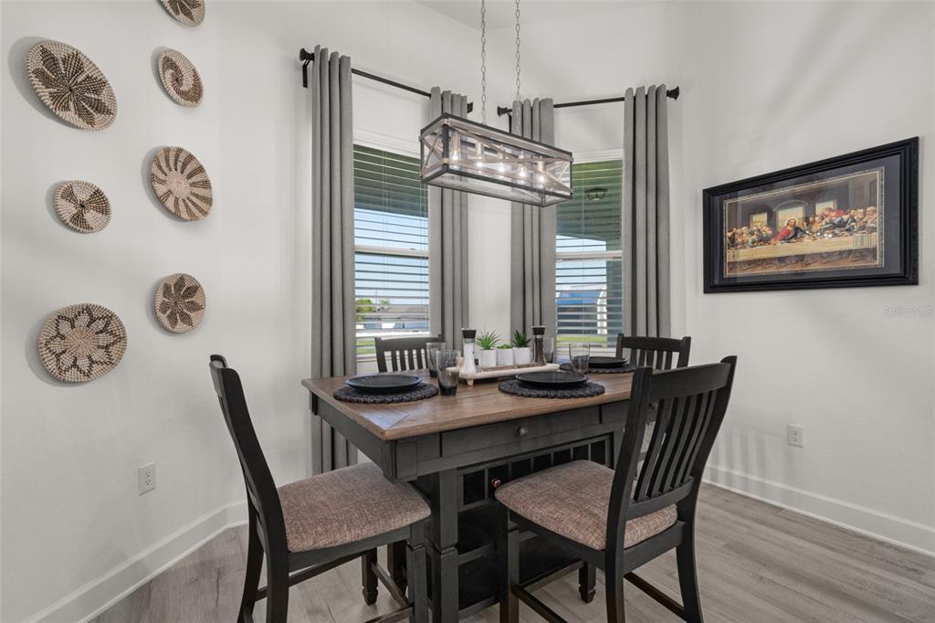 1113 Caloosa Ridge Way Babson Park, FL 33827 - Photo 28 of 77 a view of a dining room with furniture and a table