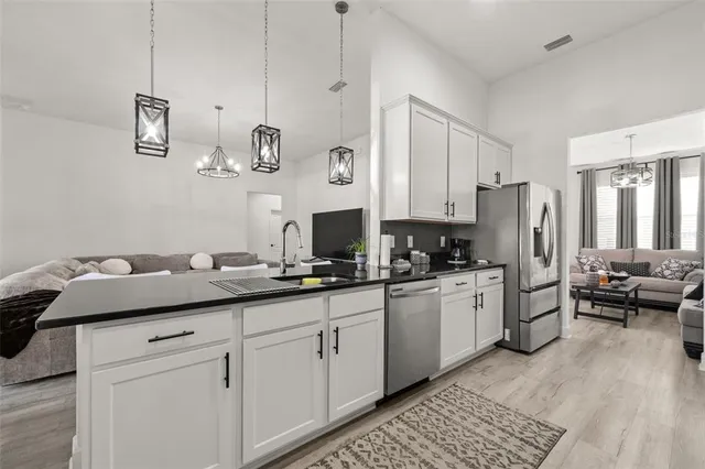 a bedroom with a bed and a ceiling fan