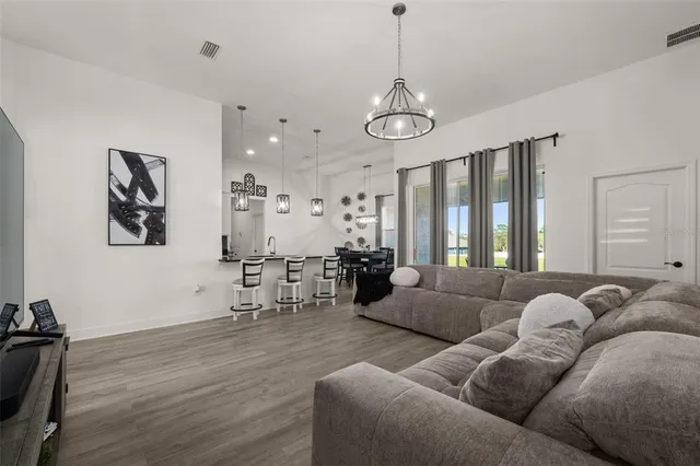 a bathroom with a sink a toilet a mirror and shower curtain
