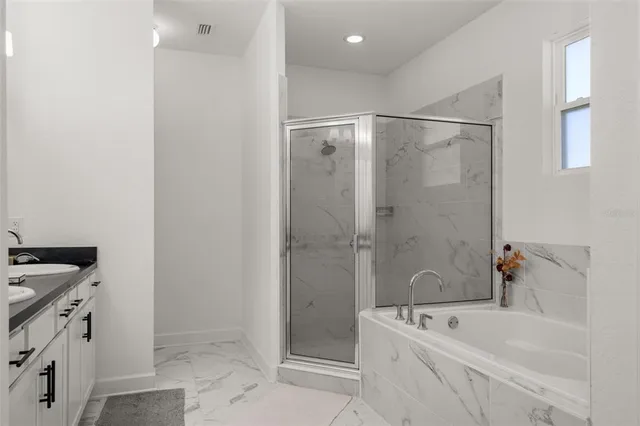 a bedroom with a bed and a table