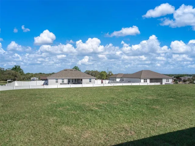 an aerial view of a house with a outdoor space