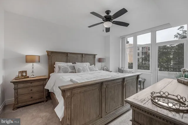 a bed room with a bed and a window