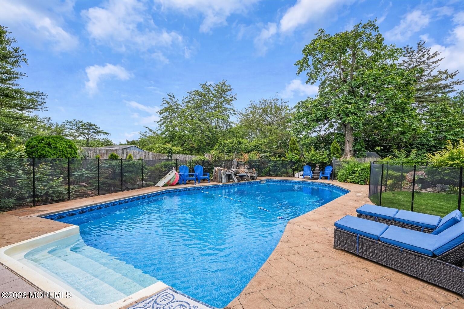 a view of a swimming pool with a patio