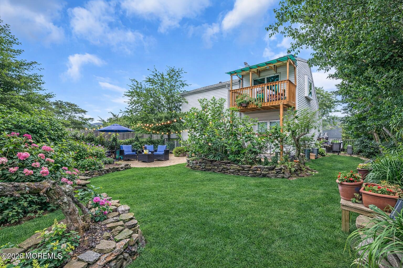 6 Hillcrest Road Manalapan, NJ 07726 - Photo 2 of 6 a green field with flowers and trees